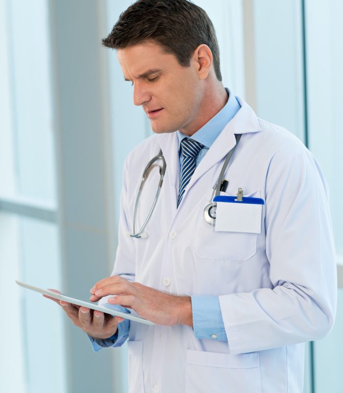Doctor with tablet