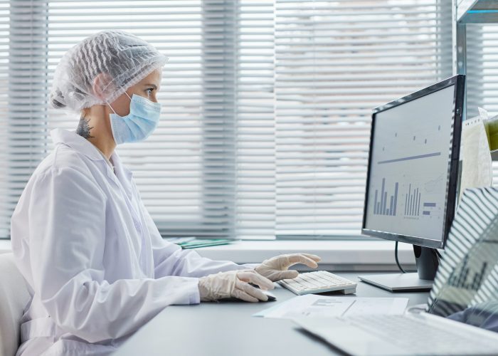 Doctor working on computer at office